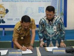Pj. Bupati Buton Teken Kerjasama Penerbitan Kartu Kredit Pemerintah Daerah