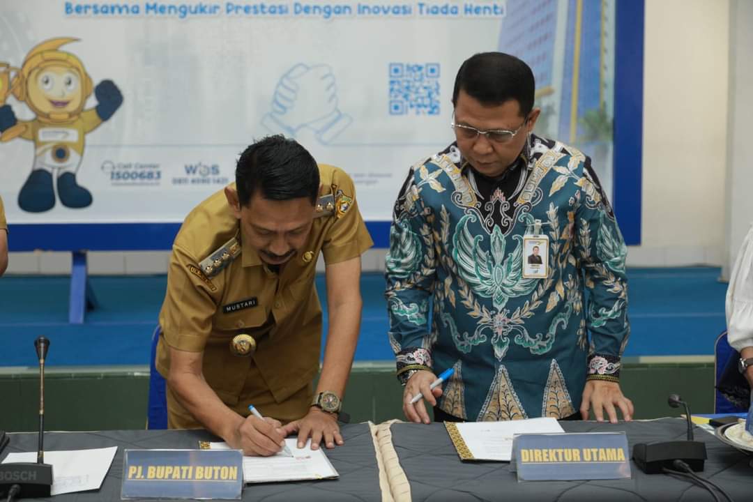 Pj. Bupati Buton Teken Kerjasama Penerbitan Kartu Kredit Pemerintah Daerah